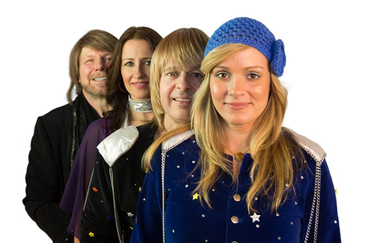 Four people standing in line, wearing colorful costumes with star patterns.